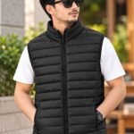 Black padded sleeveless vest jacket with horizontal quilted stitching and zip pockets